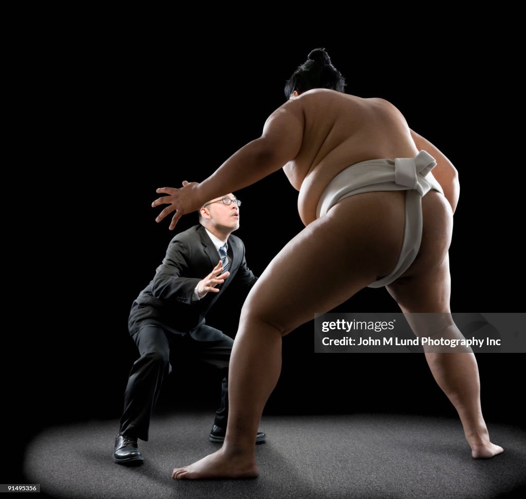 Pacific Islander sumo wrestler challenging businessman