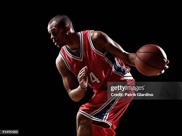 african basketball player holding basketball - basket ball player stock pictures, royalty-free photos & images