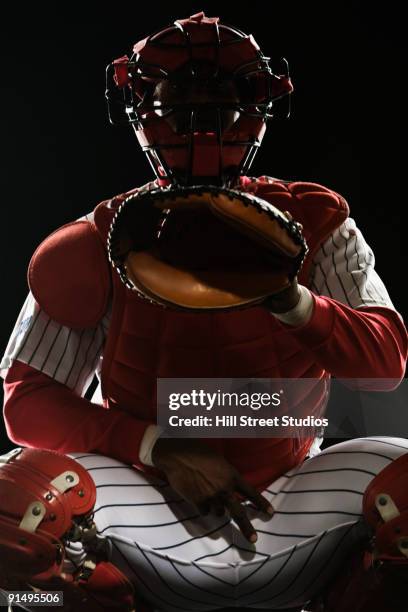 african baseball catcher gesturing during game - baseball catcher ストックフォトと画像