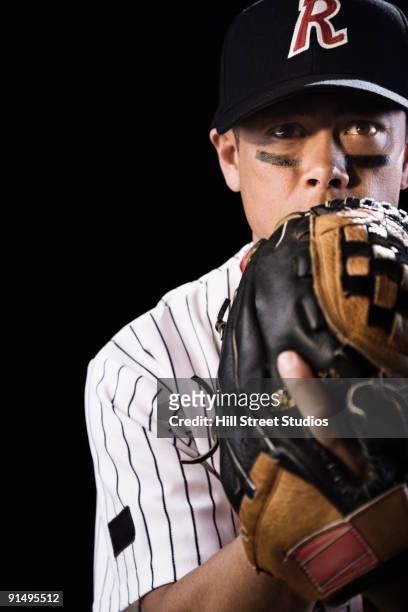 mixed race baseball player pitching - baseball pitcher isolated stock pictures, royalty-free photos & images