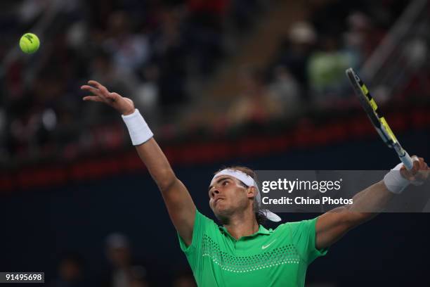 Rafael Nadal of Spain serves against Marcos Baghdatis of Cyprus in his first round match during day five of the 2009 China Open at the National...