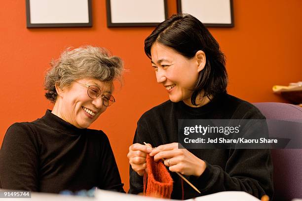 asian mother and daughter knitting - japanese mother daughter stock pictures, royalty-free photos & images