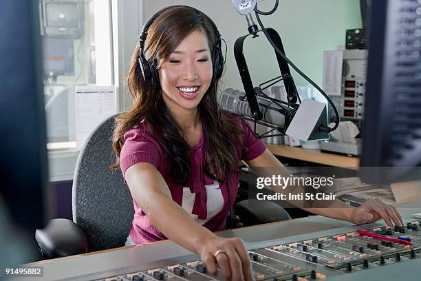 asian dj working at radio station - ラジオdj ストックフォトと画像