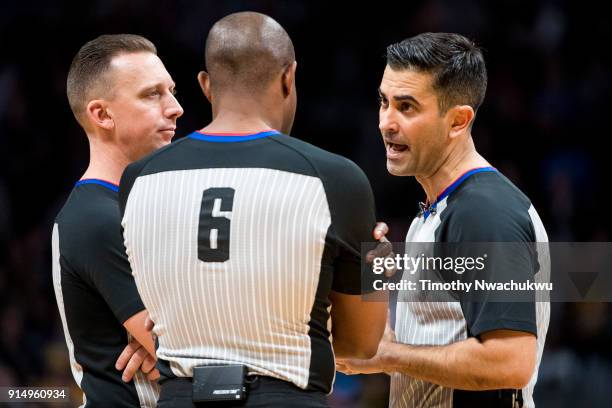 Referee Zach Zarba speaks with referees Tony Brown and Justin Van Duyne at Pepsi Center on February 1, 2018 in Denver, Colorado. NOTE TO USER: User...