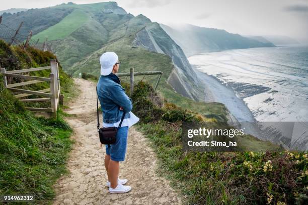 enjoying view of the flysch in zumaia. basque country. spain. - zumaia imagens e fotografias de stock