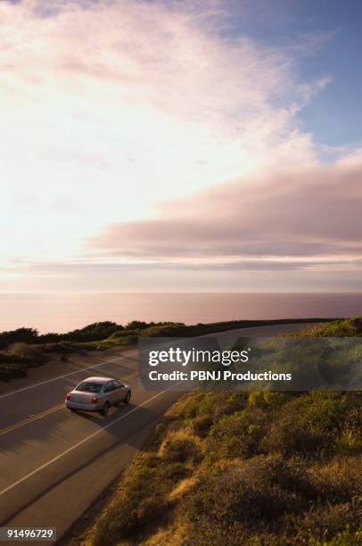 high angle view of car on coastal highway - sunset motivation stock pictures, royalty-free photos & images