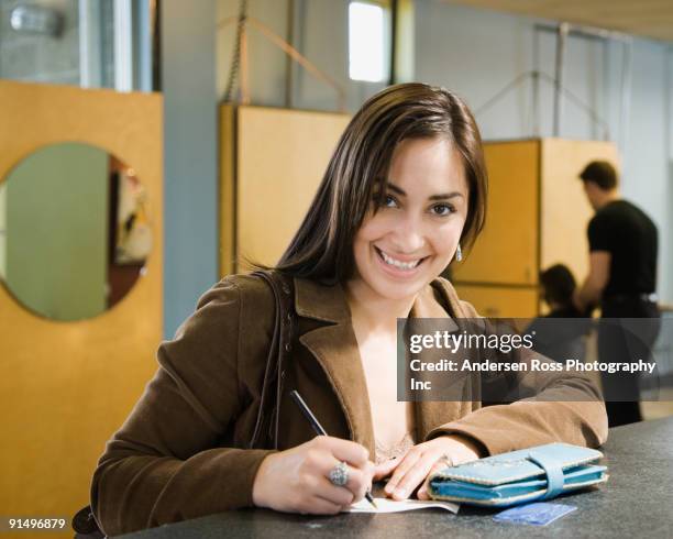 Woman Writecheck Woman Signing Check Photos and Premium High Res Pictures - Getty Images