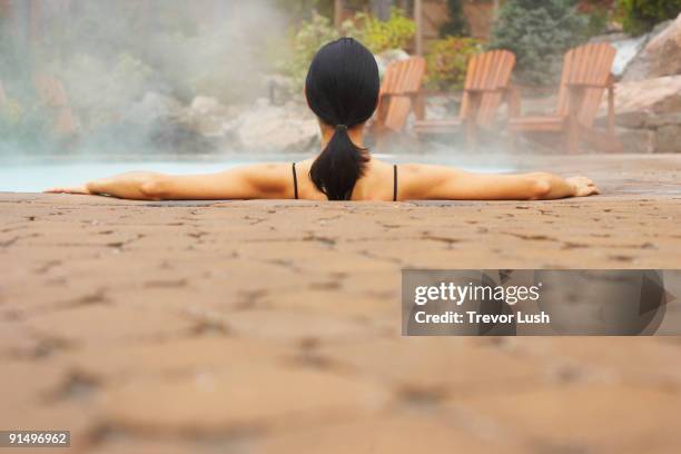 rear view of woman sitting in hot tub - hot latina women 個照片及圖片檔