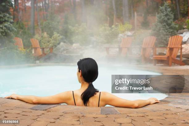 rear view of woman sitting in hot tub - hot latina women 個照片及圖片檔