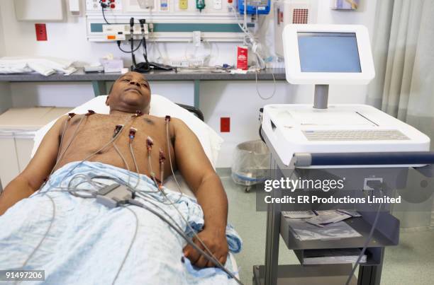 african american man in hospital bed - cardiology stock pictures, royalty-free photos & images