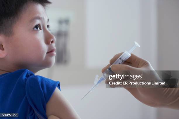 Kid Getting A Injection 3,286 Boy Getting An Injection Stock Photos, High-Res Pictures, and ...