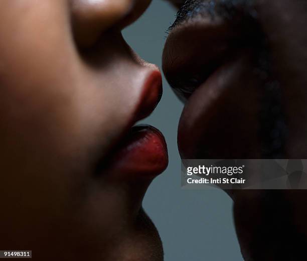 close up of couple about to kiss - couple lust stockfoto's en -beelden