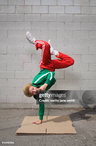 mixed race boy breakdancing - breakdance stock-fotos und bilder