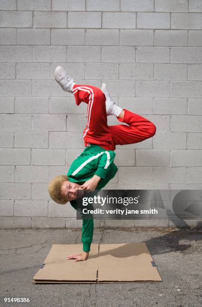 mixed race boy breakdancing - street dance stock pictures, royalty-free photos & images