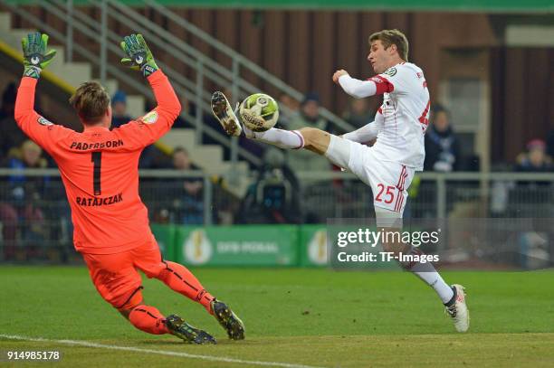 Michael Ratajczak of Paderborn and Thomas Mueller of Bayern Muenchen battle for the ball during the DFB Cup match between SC Paderborn and Bayern...