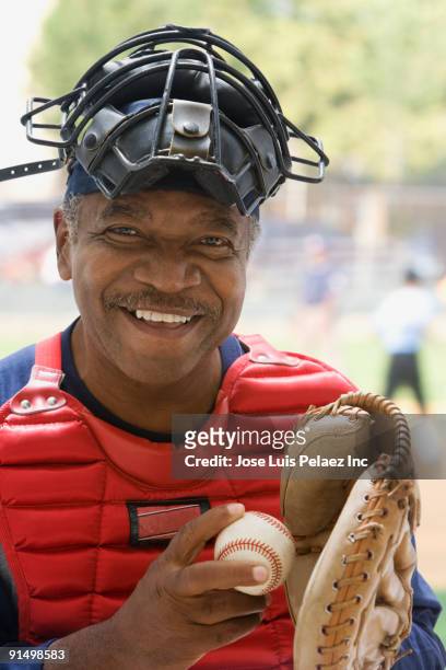 african umpire smiling - baseball catcher ストックフォトと画像