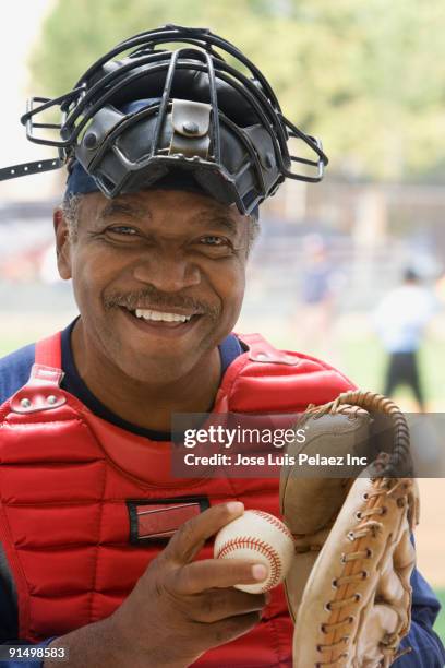 african umpire smiling - baseball catcher stock pictures, royalty-free photos & images