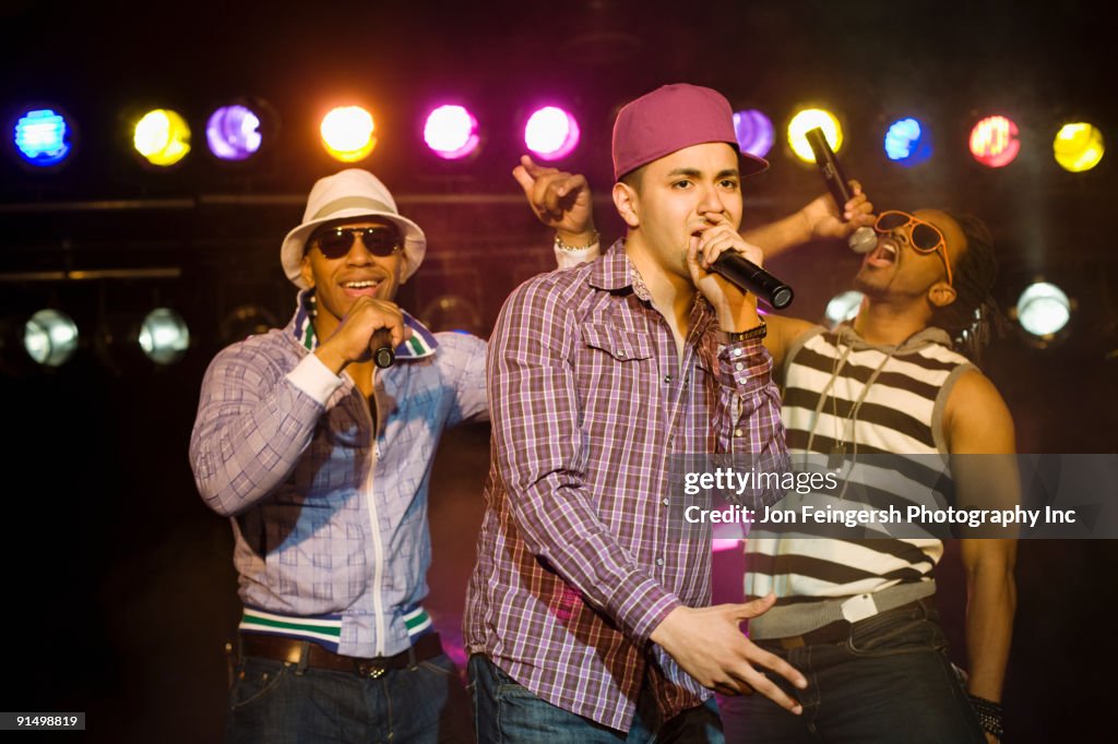 Hip hop musical group performing onstage