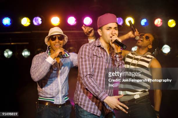 hip hop musical group performing onstage - rapper stock pictures, royalty-free photos & images