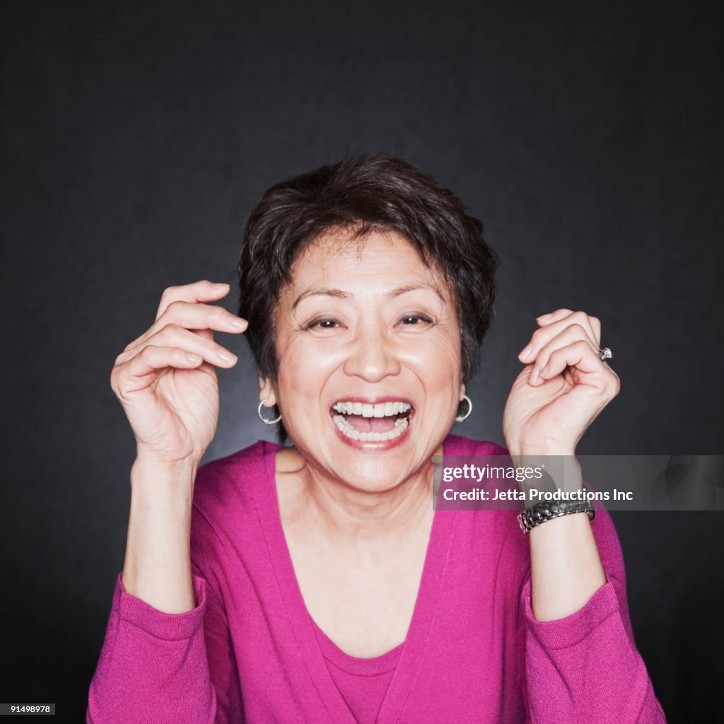Asian woman laughing