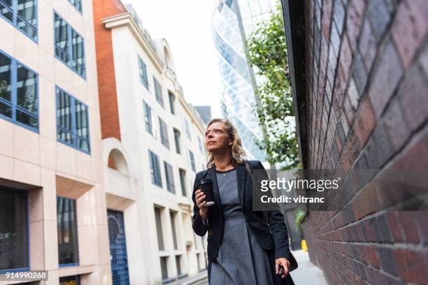 businesswoman in london - city of london workers stock pictures, royalty-free photos & images