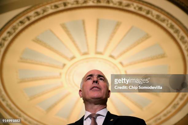 Sen. Robert Casey talks to reporters during a news conference following the weekly policy luncheon at the U.S. Capitol February 6, 2018 in...