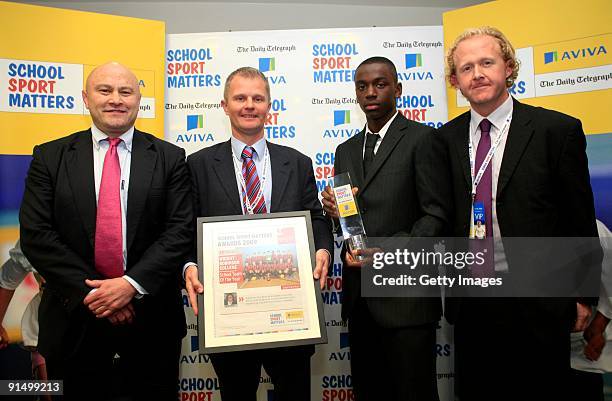 Former rugby player Brian Moore poses with Wright Robinson School's Martin Haworth, Micah Evans and Mick Halshaw after winning the School Team of the...