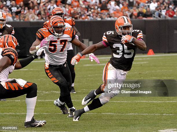 Running back Jerome Harrison of the Cleveland Browns runs away from linebacker Dhani Jones of the Cincinnati Bengals during a game on October 4, 2009...