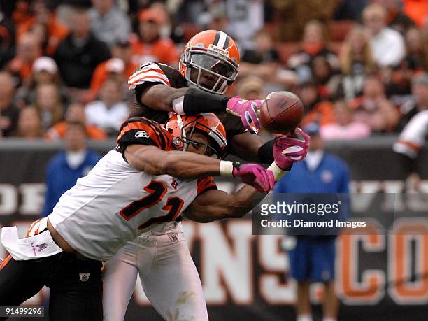 Wide receiver Laveranues Coles of the Cincinnati Bengals battles defensive back Brodney Pool of the Cleveland Browns for a pass during a game on...