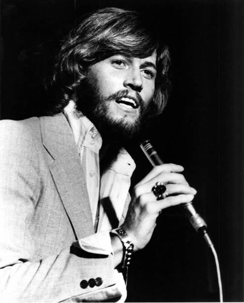 https://media.gettyimages.com/id/91499297/photo/barry-gibb-from-the-bee-gees-performs-live-on-stage-in-amsterdam-in-1975.jpg?s=612x612&w=0&k=20&c=ta-P_DbEPSASglCLxA5vgsraID1gXNtctmZ6q2fIyOo=