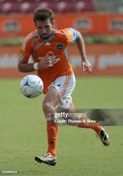 Mike Chabala of the Houston Dynamo dribbles against the Kansas City Wizards on October 4, 2009 at Robertson Stadium in Houston, Texas.