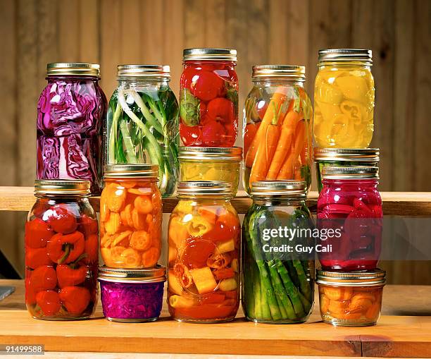 mason jars with canned vegetables - メイソンジャー ストックフォトと画像