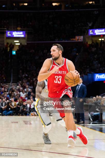 Isaiah Thomas of the Cleveland Cavaliers tries to guard Ryan Anderson of the Houston Rockets during the first half at Quicken Loans Arena on February...