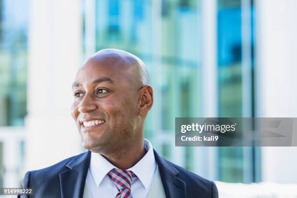 african-american businessman outside office building - male portrait suit and tie 40 year old stock pictures, royalty-free photos & images