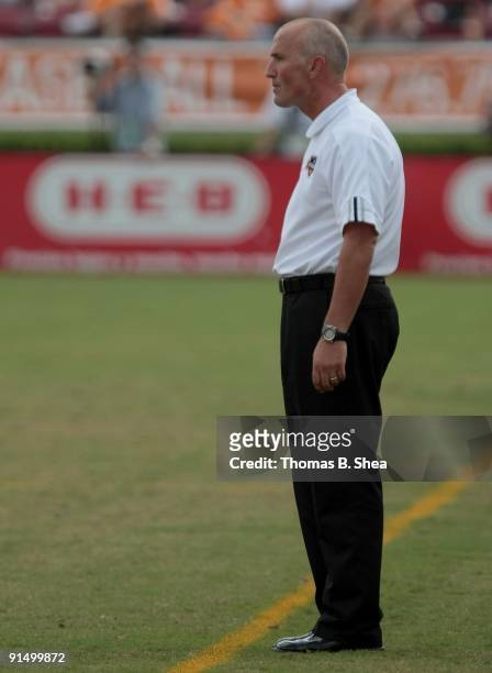 Head coach Dominic Kinnear of the Houston Dynamo stares at referee Jorge Gonzalez while the Dynamo play against the Kansas City Wizards on October 4,...