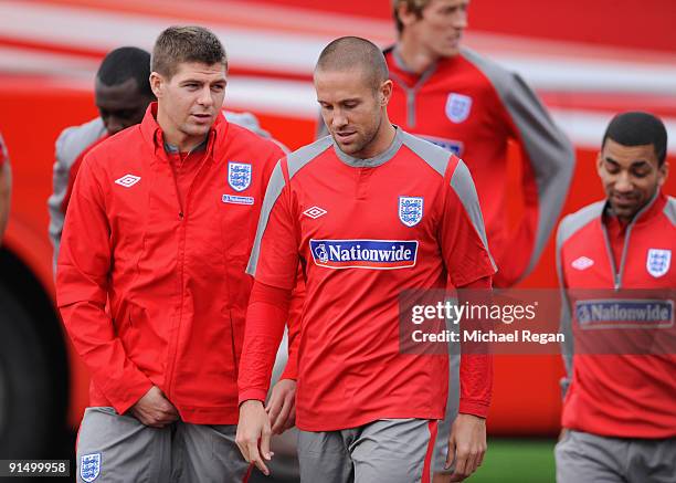 Steven Gerrard talks to Matthew Upson during the England training session at London Colney on October 6, 2009 in St Albans, England.