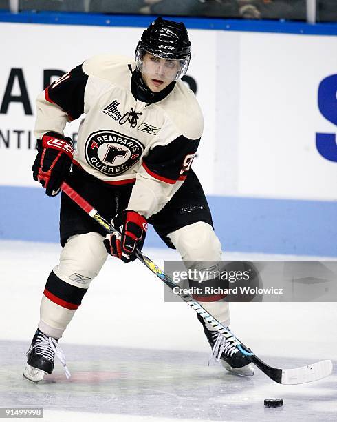 Ryan Bourque of the Quebec Remparts skates with the puck during the game against the Baie Comeau Drakkar at Colisee Pepsi on October 2, 2009 in...