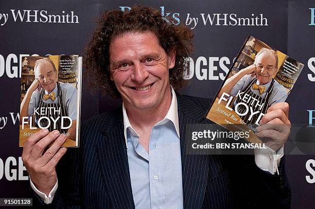 Chef Marco Pierre White presents copies of Keith Floyd's new autobiography, Stirred But Not Shaken in Selfridge's department store in London on...