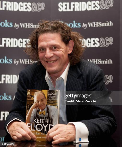 Chef Marco Pierre White signs copies of the late Keith Floyd's book 'Stirred But Not Shaken' at Selfridges on October 6, 2009 in London, England.