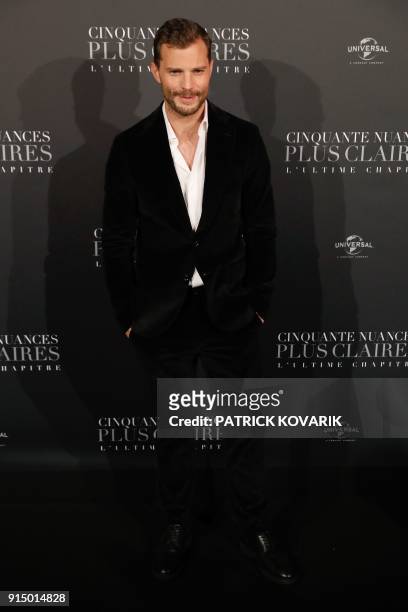 Actor Jamie Dornan poses as he arrives to attend 'Fifty Shades Freed - 50 Nuances Plus Claires' Premiere at Salle Pleyel in Paris on February 6,...