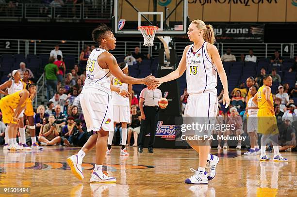 Cappie Pondexter of the Phoenix Mercury celebrates with teammate Penny Taylor in Game Three of the Western Conference Finals against the Los Angeles...