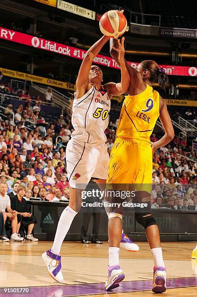 Tangela Smith of the Phoenix Mercury puts up a shot against Lisa Leslie of the Los Angeles Sparks in Game Three of the Western Conference Finals...