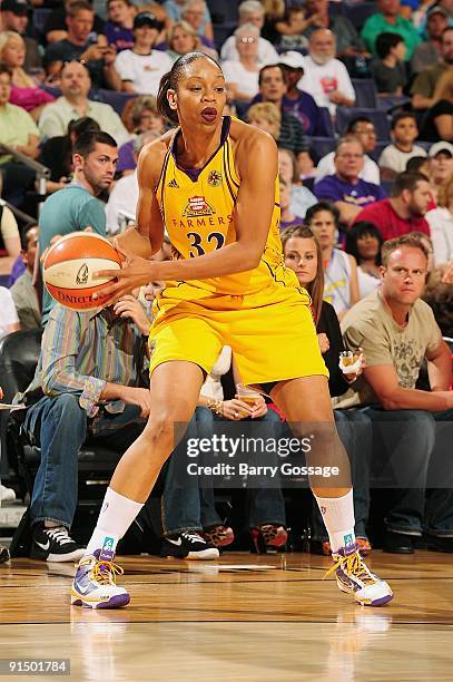 Tina Thompson of the Los Angeles Sparks moves the ball to the basket in Game Two of the Western Conference Finals against the Phoenix Mercury during...