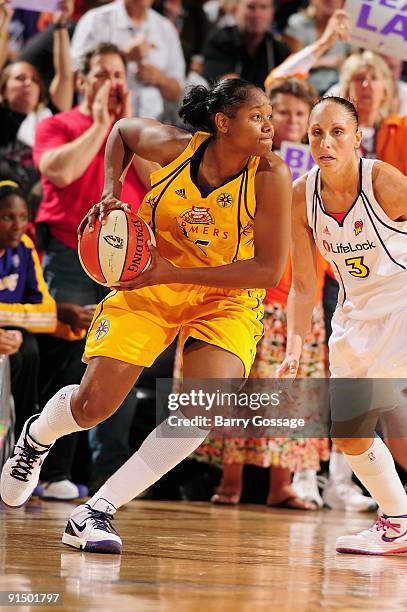 Noelle Quinn of the Los Angeles Sparks drives the ball against Diana Taurasi of the Phoenix Mercury in Game Two of the Western Conference Finals...