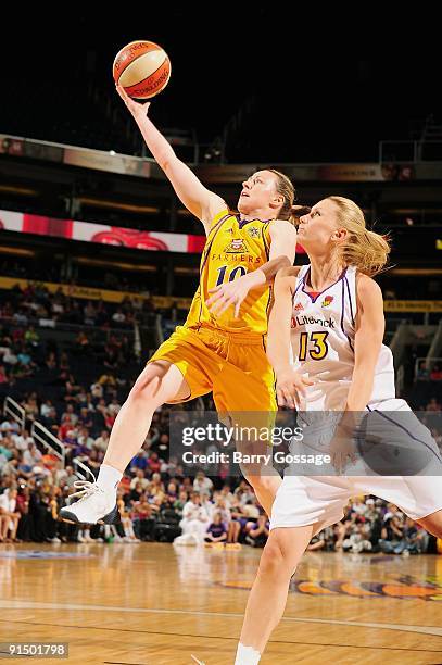 Kristi Harrower of the Los Angeles Sparks lays up a shot against Penny Taylor of the Phoenix Mercury in Game Three of the Western Conference Finals...