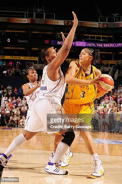Candace Parker of the Los Angeles Sparks drives the ball against Le'coe Willingham of the Phoenix Mercury in Game Two of the Western Conference...