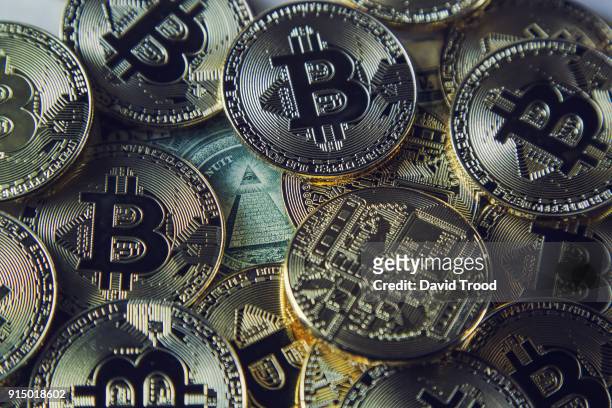 physical version of bitcoin coin aka virtual money. - david trood stock-fotos und bilder