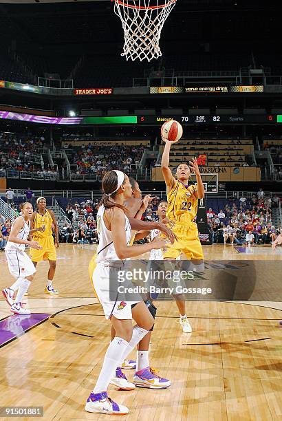 Betty Lennox of the Los Angeles Sparks puts up a shot against Cappie Pondexter of the Phoenix Mercury in Game Two of the Western Conference Finals...