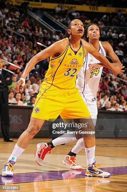 Tina Thompson of the Los Angeles Sparks boxes out DeWanna Bonner of the Phoenix Mercury in Game Two of the Western Conference Finals during the 2009...