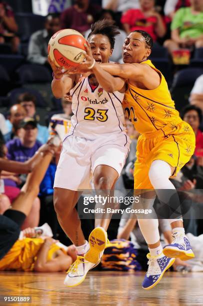 Cappie Pondexter of the Phoenix Mercury and Betty Lennox of the Los Angeles Sparks fight for the ball in Game Two of the Western Conference Finals...